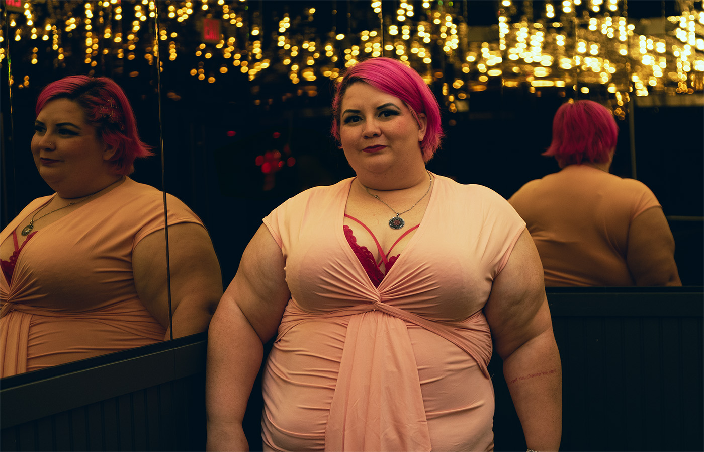 Marsha Darling, a pink haired, plus-size woman